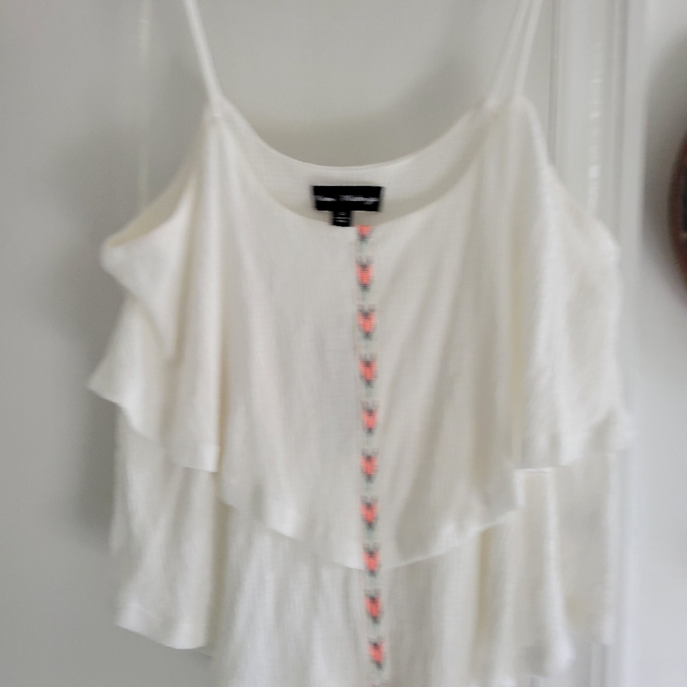 White ruffled top